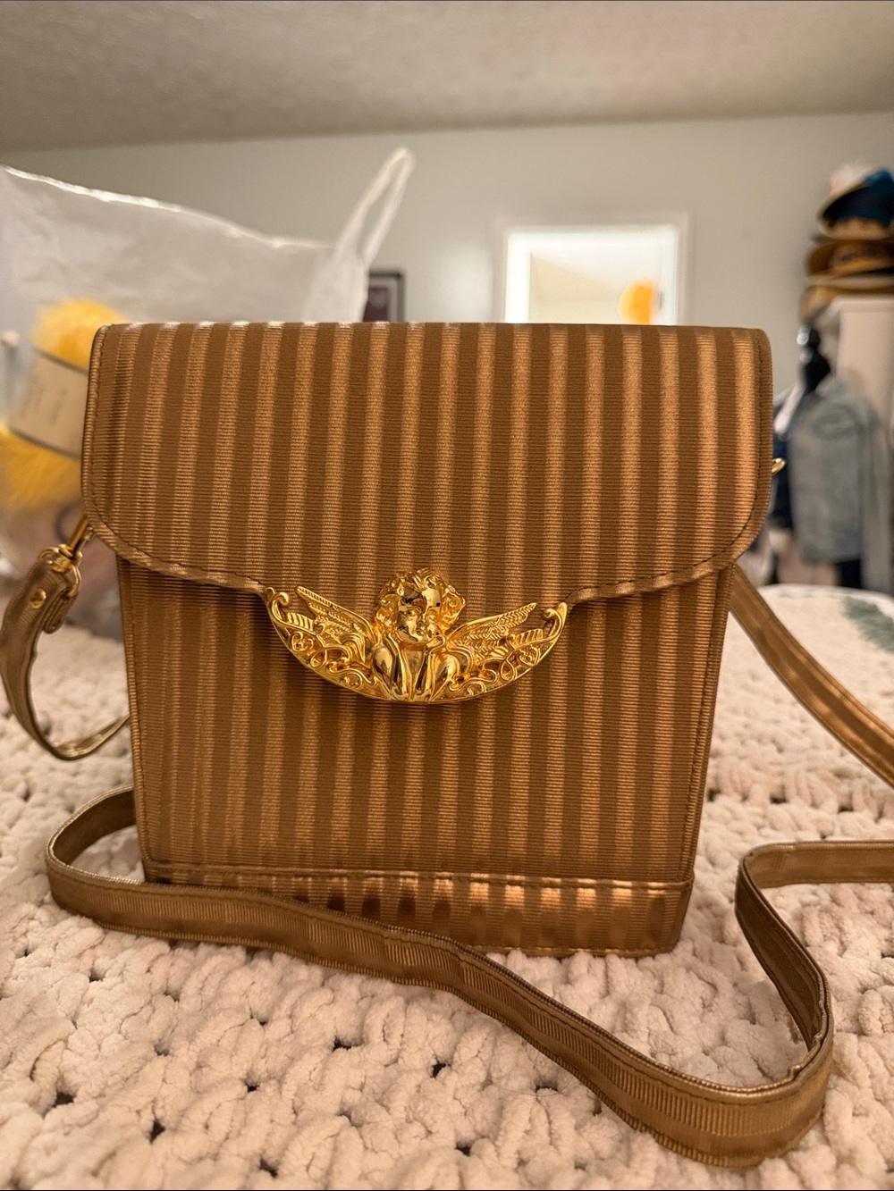 Gold-Tone Striped Crossbody Bag with Decorative Crest